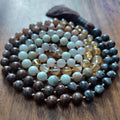 Stone and Spirit Chakra Mala with Larvikite, Brown Snowflake Obsidian, Sunstone, Citrine, Amazonite, and White Agate