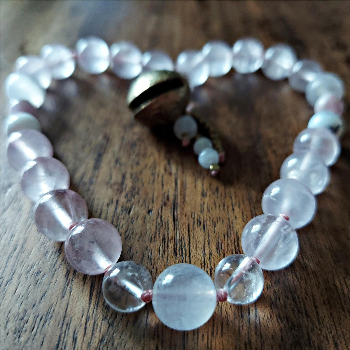 The Moonflower Pocket Mala with Rose Quartz, Selenite, Kunzite, and Brass Bell