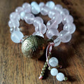 The Moonflower Pocket Mala with Rose Quartz, Selenite, Kunzite, and Brass Bell
